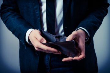 Business man opening an empty wallet